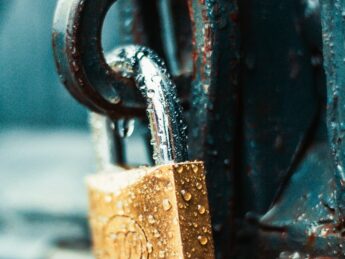 close up photography of wet padlock